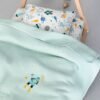 Candy Πικέ Βρεφική Κουβέρτα Aqua στρωμένη σε κρεβάτι