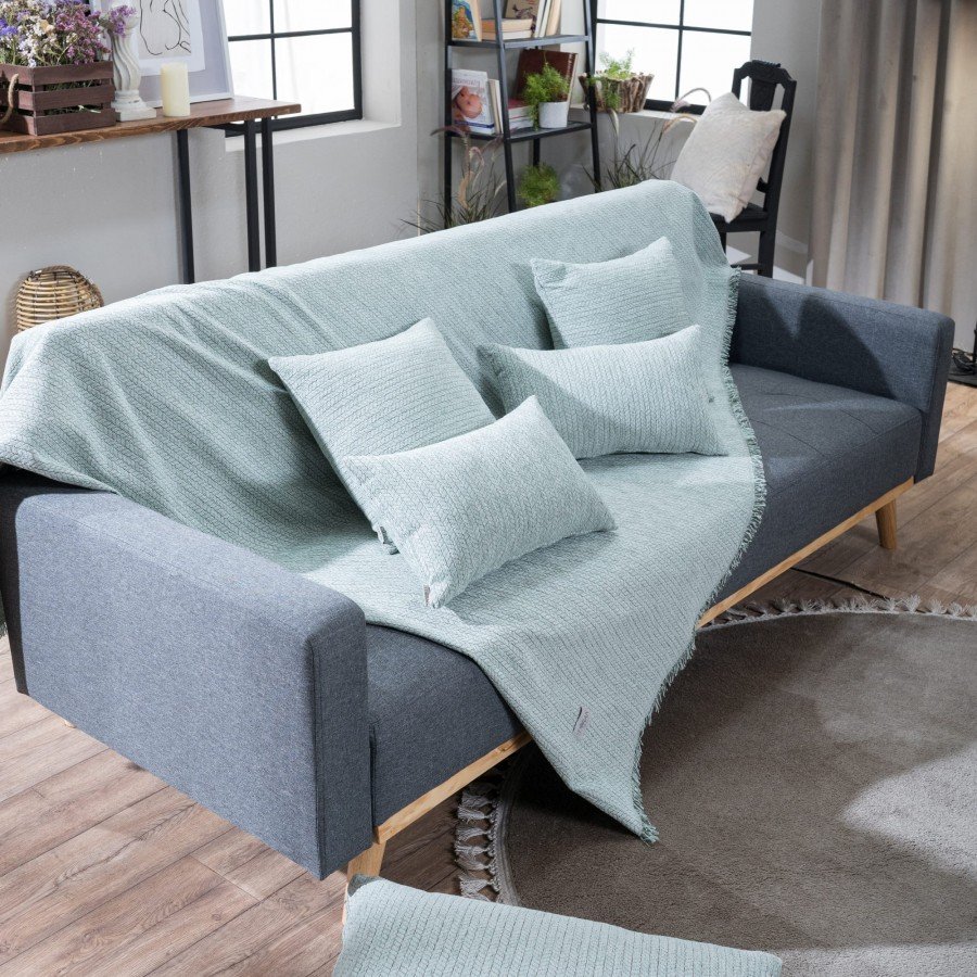 Melrose Ριχτάρι 13 στρωμένο σε καναπέ με μαξιλάρια